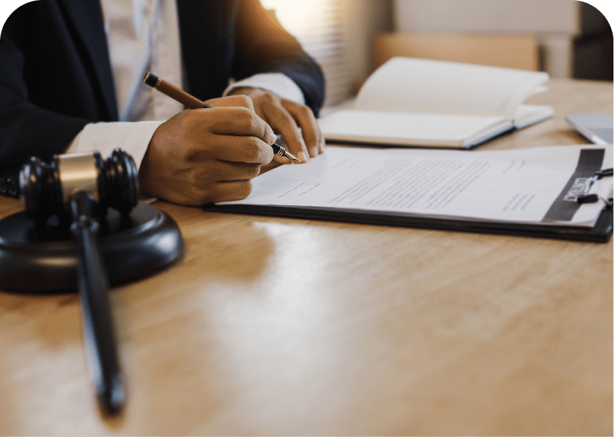 Lawyer writing on legal papers