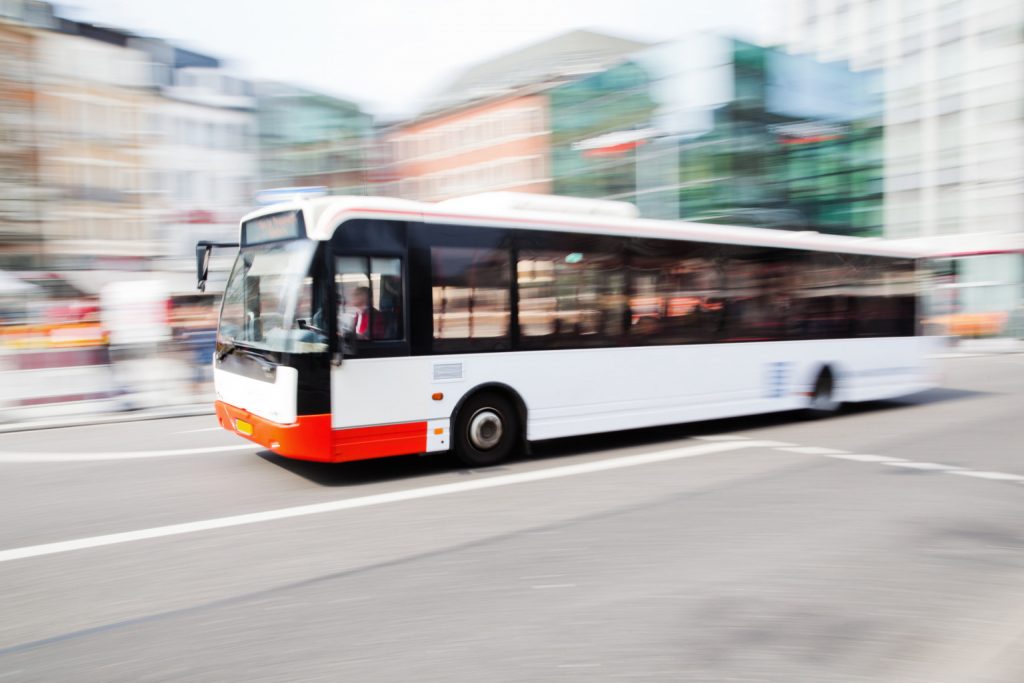 Blurred motion of a city bus driving