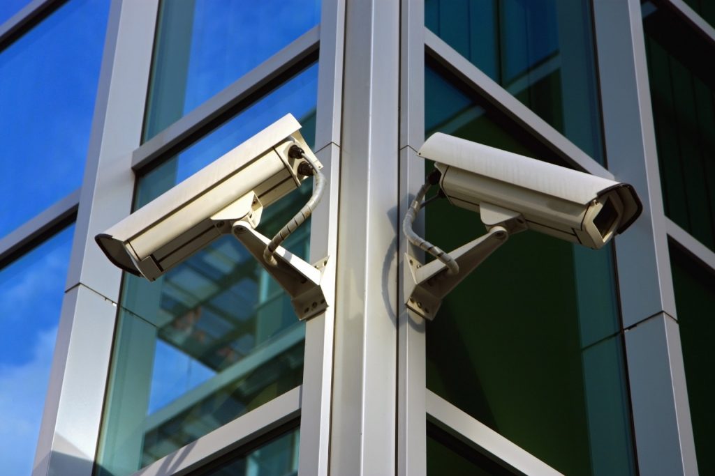 Security cameras on modern building facade
