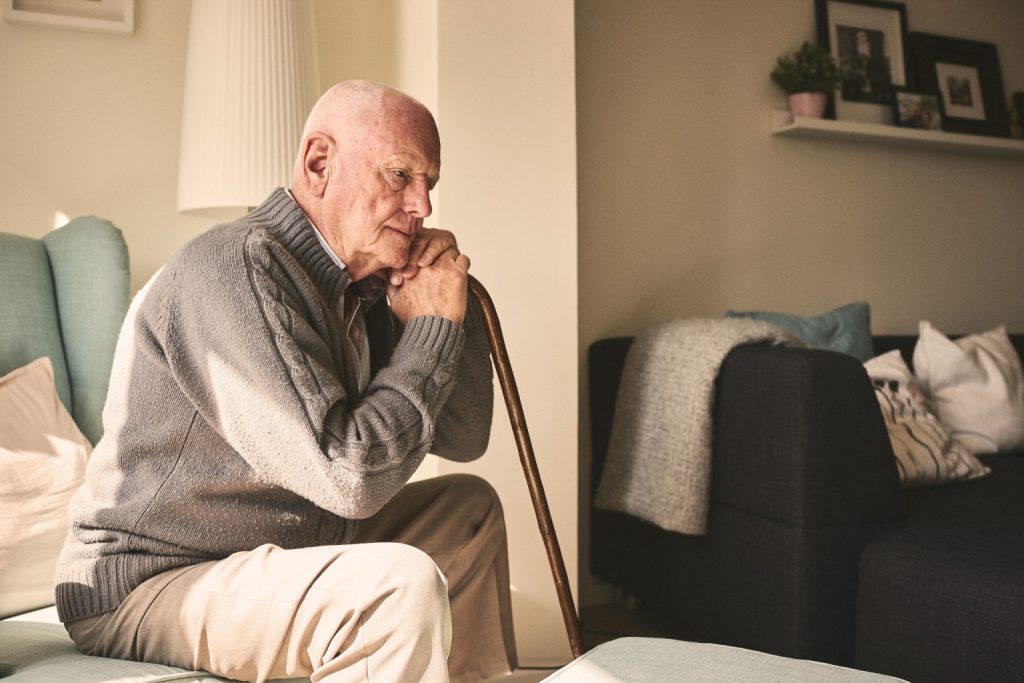 Older gentleman resting on a chair