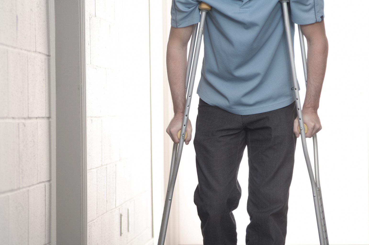 Man using crutches for support