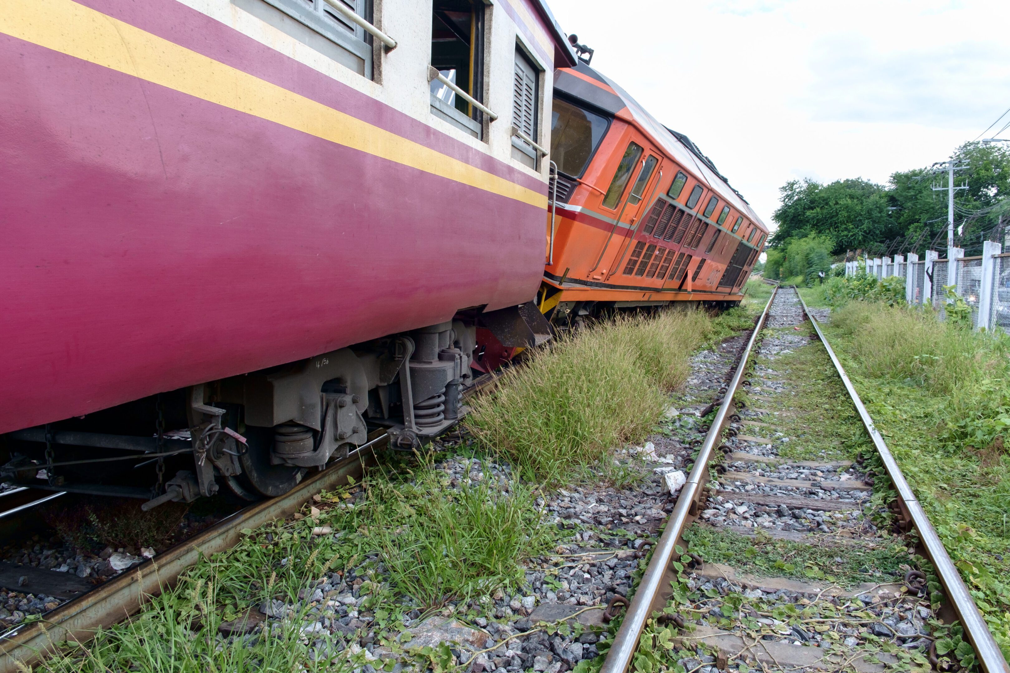 Derailed train beside parallel tracks