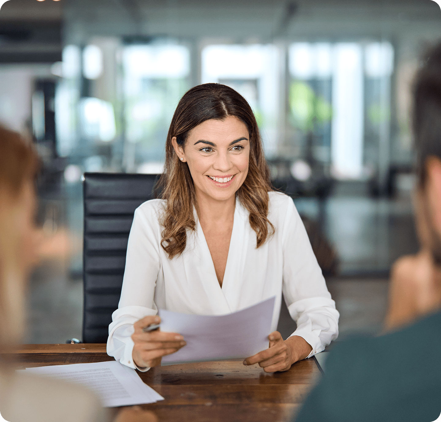 Woman smiling during a business meeting