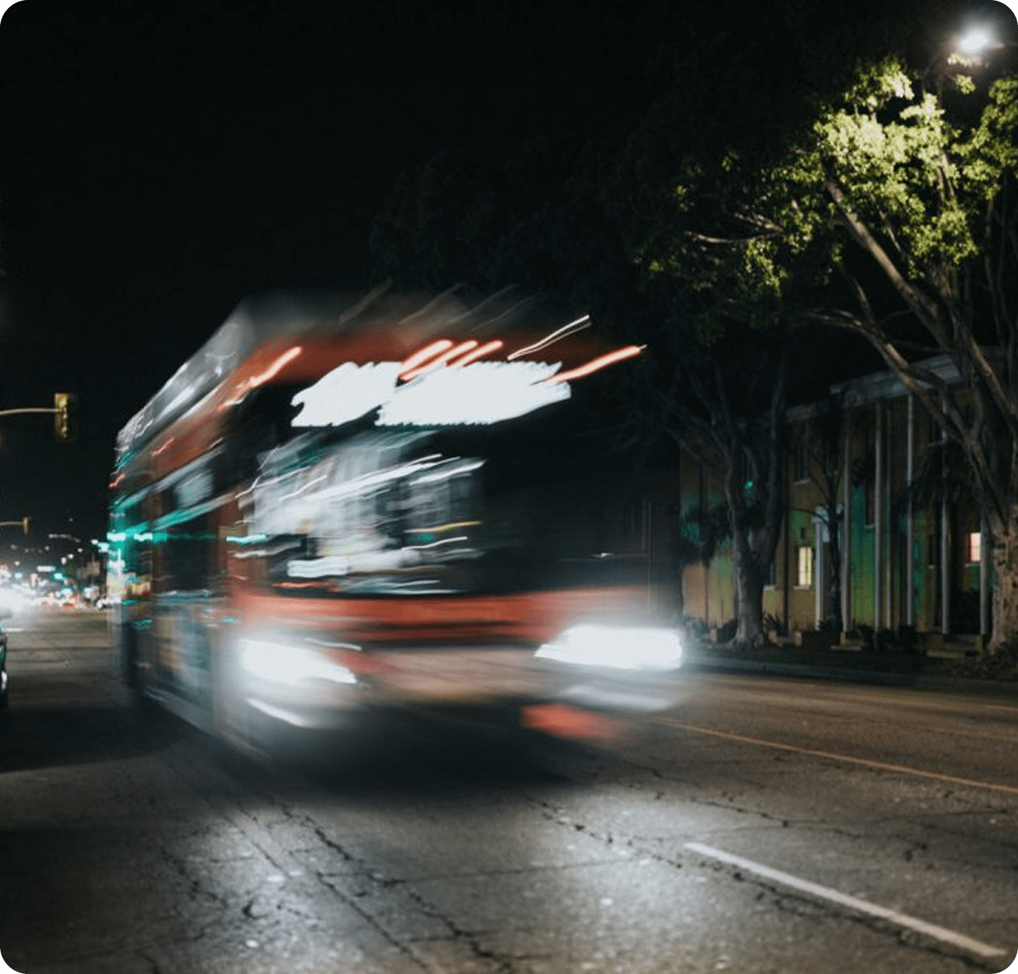 Nighttime motion blur of city bus