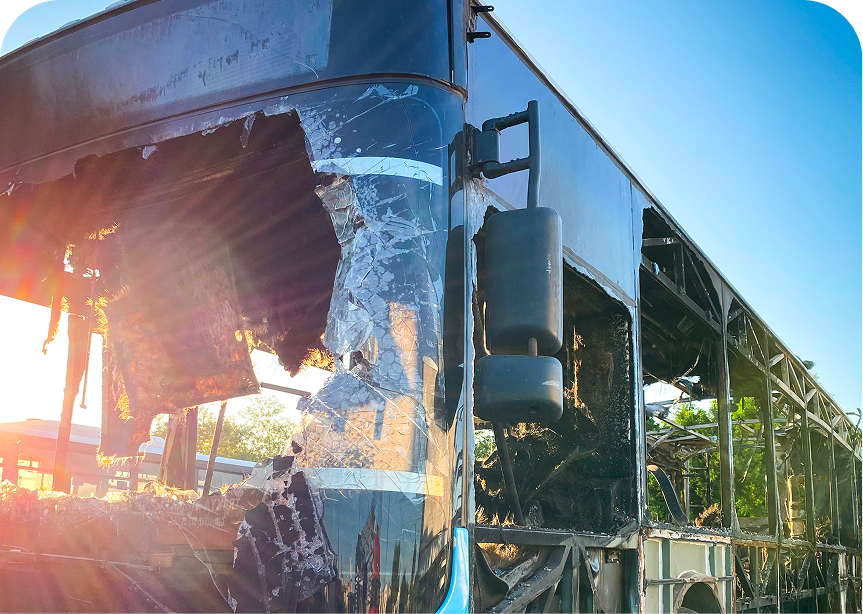Damaged bus with shattered windows