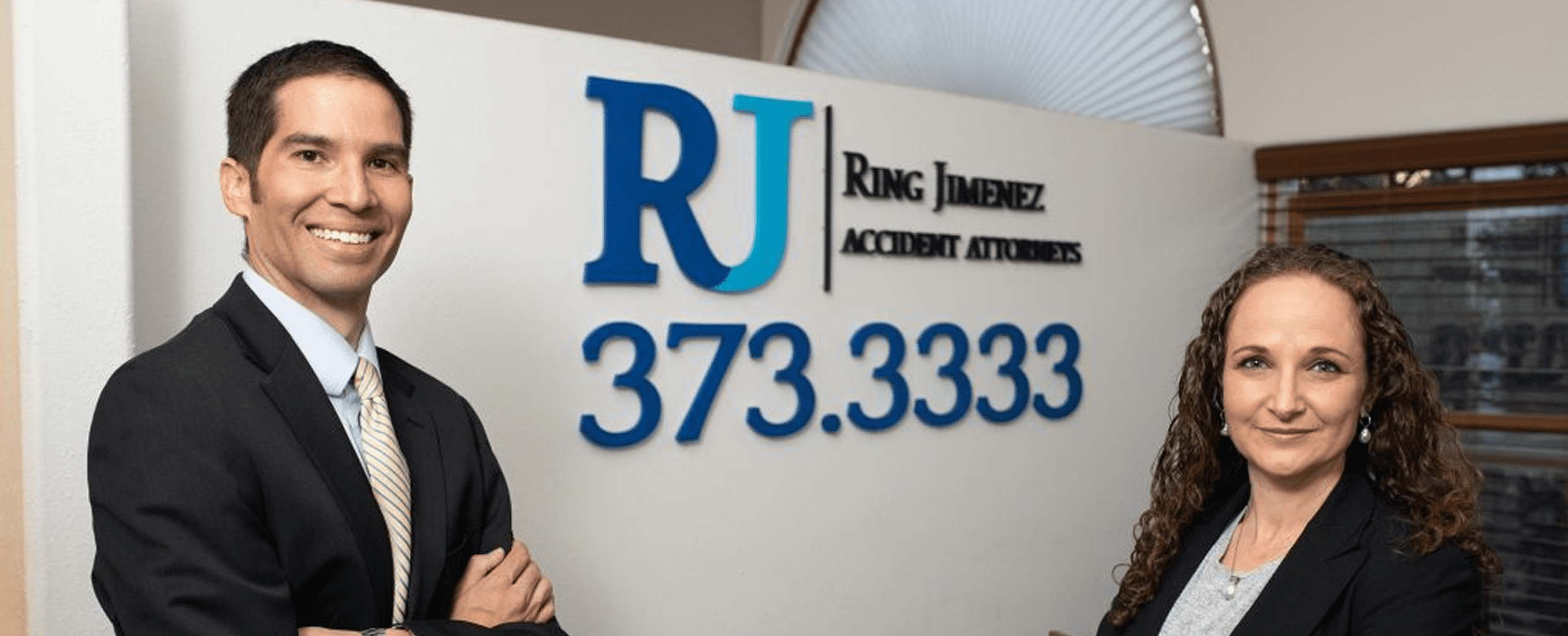 Accident attorneys posing in business setting