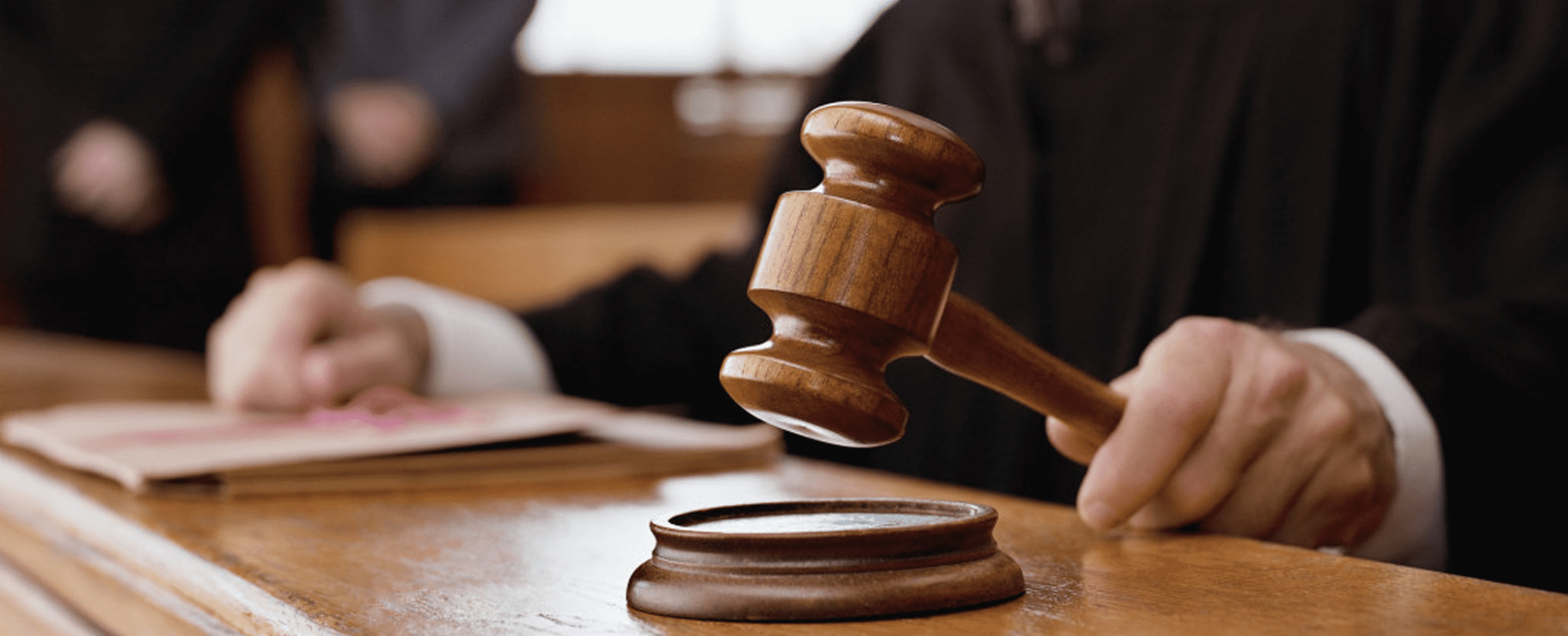Legal proceedings with gavel on desk