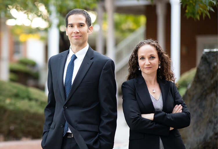 Two people in formal attire outside