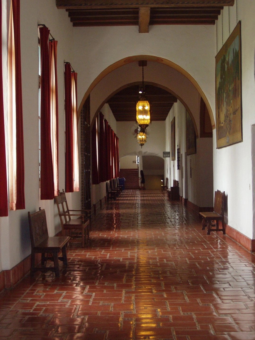 Long arched hallway with hanging lanterns