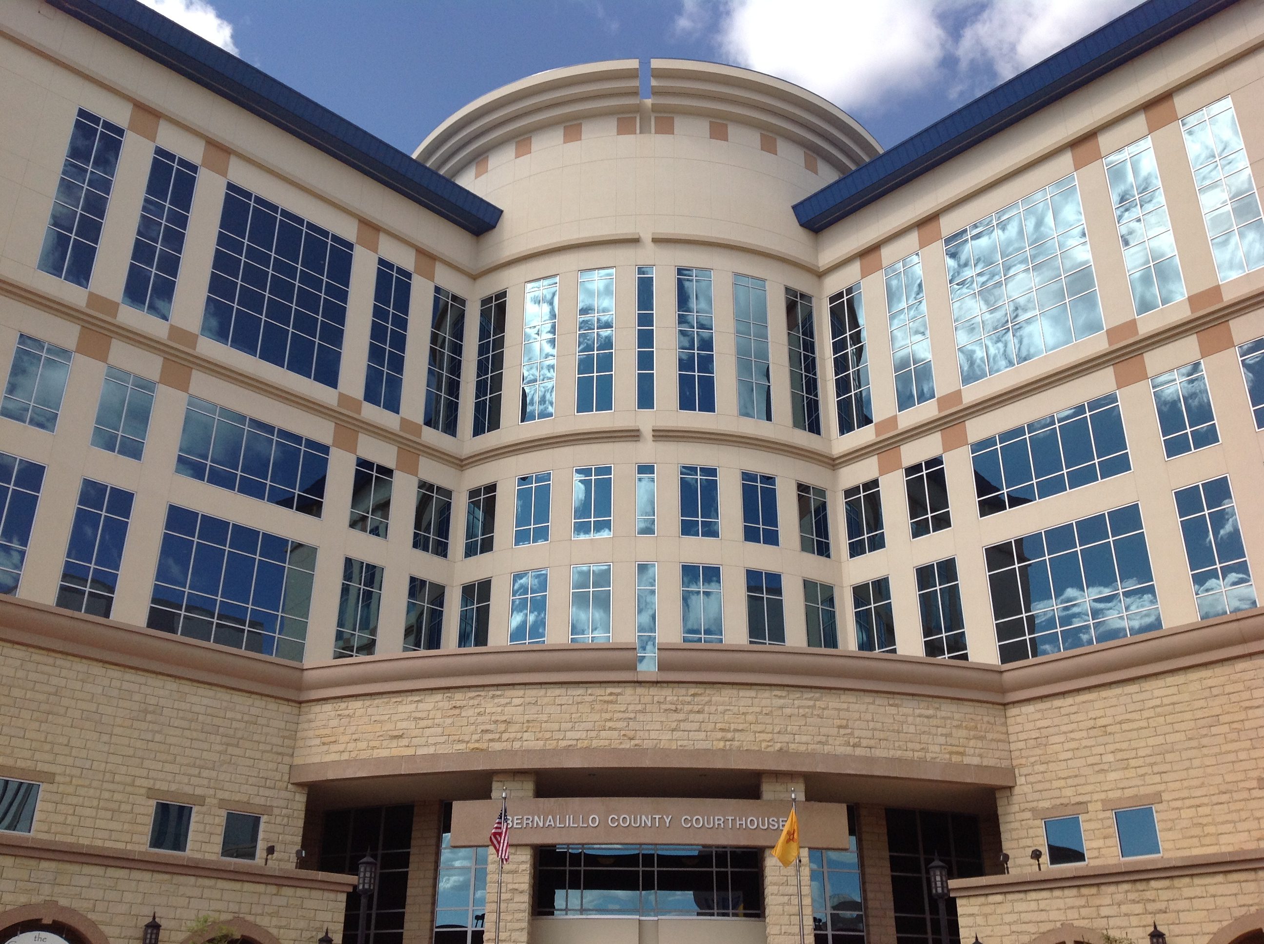 Modern courthouse building with reflective glass facade