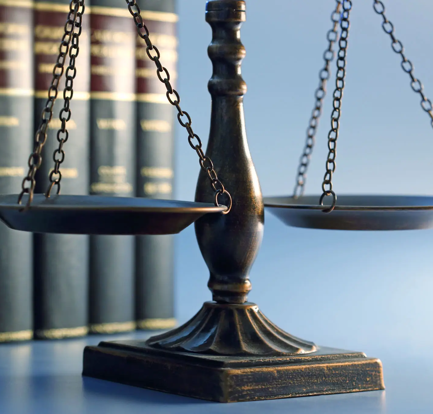 Scales of justice with law books